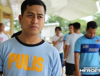 A police officer pictured in one of the first Songs for Heroes 2 rehearsals gathering performers from the PNP and AFP.