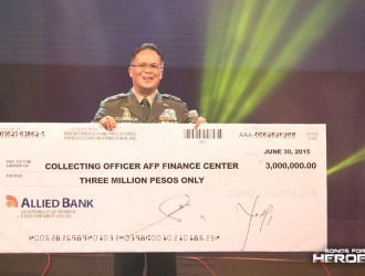 Gen. Catapang receives the check worth Php 4 million, half of the proceeds raised by Songs for Heroes 2.