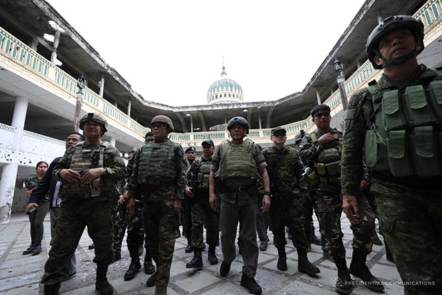 President Rodrigo Roa Duterte makes his fourth visit to the troops battling against the terrorists in Marawi City. This time, on September 11, 2017, the President went to the Grand Mosque which has been recently retaken by the government troops from the clutches of the terrorists Maute Group after three months of relentless skirmish. Joining the President were Defense Secretary Delfin Lorenzana, National Security Adviser Hermogenes Esperon Jr., Presidential Adviser on Military Affairs Arthur